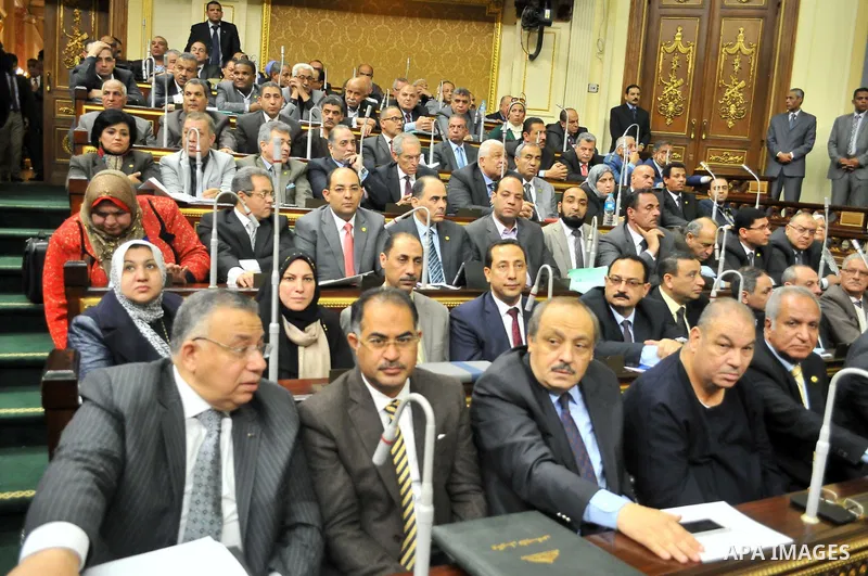 Members of Egypt's Parliament attend the session of the Parliament, in Cairo, Egypt, Jan. 12, 2016. The 596-seat assembly, elected in November and December, packed with supporters of President Abdel-Fattah el-Sissi, sign...