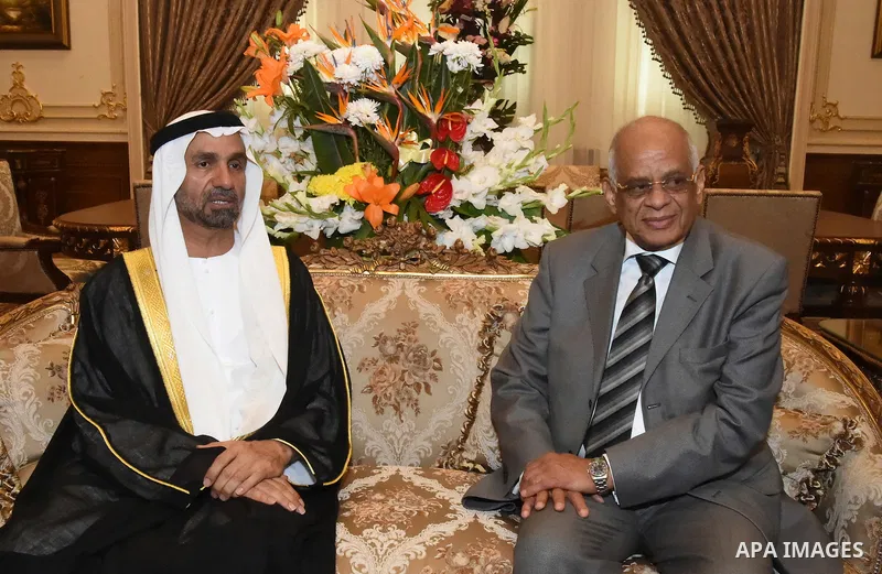 Egyptian law professor Ali Abdel-Al the newly elected speaker of Egypt's parliament meets with Ahmed bin Mohammed Al Jarwan, head of the Arab Parliament in Cairo, Egypt on Jan. 12, 2016. Photo by Stranger