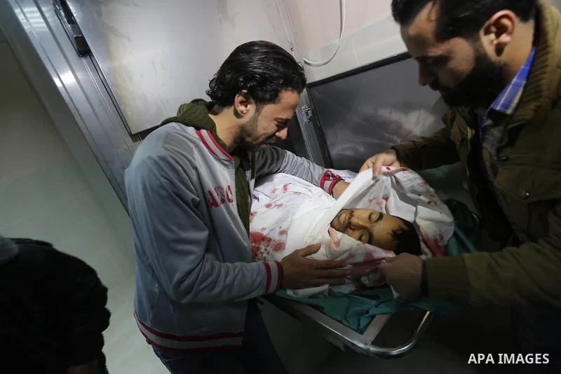 Relatives of Palestinian Moussa Zuaiter, mourn over his body at a morgue in hospital in the northern Gaza Strip January 13, 2016. The Israeli aircraft attacked a group of Palestinians in the Gaza Strip on Wednesday who t...