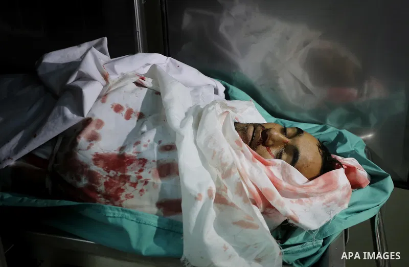 Relatives of Palestinian Moussa Zuaiter, mourn over his body at a morgue in hospital in the northern Gaza Strip January 13, 2016. The Israeli aircraft attacked a group of Palestinians in the Gaza Strip on Wednesday who t...