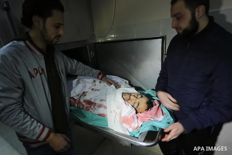 Relatives of Palestinian Moussa Zuaiter, mourn over his body at a morgue in hospital in the northern Gaza Strip January 13, 2016. The Israeli aircraft attacked a group of Palestinians in the Gaza Strip on Wednesday who t...