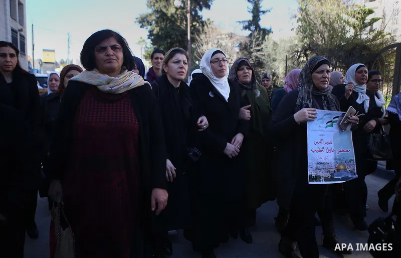 Palestinian Relatives of Mustafa al-Khatib,17, who Israeli military said was shot dead by Israeli soldiers after he tried to stab a soldier on 12 October, mourn during his funeral in the West Bank city of Ramallah, on Ja...