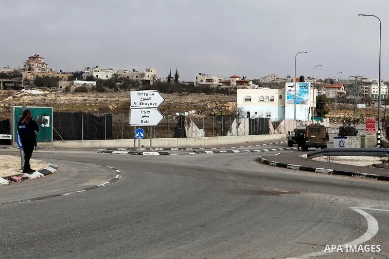 A female Israeli soldier stands guard near the scene of a stabbing attack at the Beit Ainun junction near Hebron on January 14, 2016. Israeli forces Thursday shot and killed a Palestinian near the Beit Ainun junction nor...