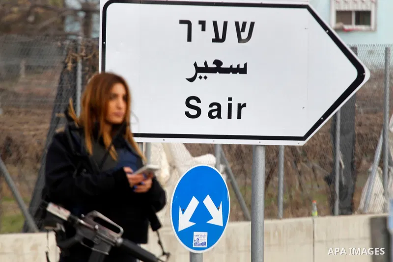 A female Israeli soldier stands guard near the scene of a stabbing attack at the Beit Ainun junction near Hebron on January 14, 2016. Israeli forces Thursday shot and killed a Palestinian near the Beit Ainun junction nor...
