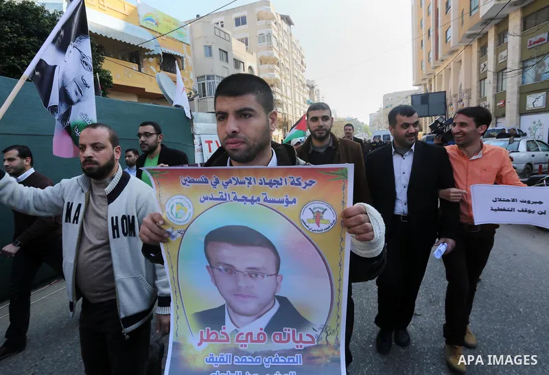 Palestinian journalists take part in a protest demanding release the Palestinian journalist Mohammed al-Qiq in Israeli jails, in front of Red cross office in Gaza city on Jan. 14, 2016. Qiq, a 33-year-old reporter for Sa...