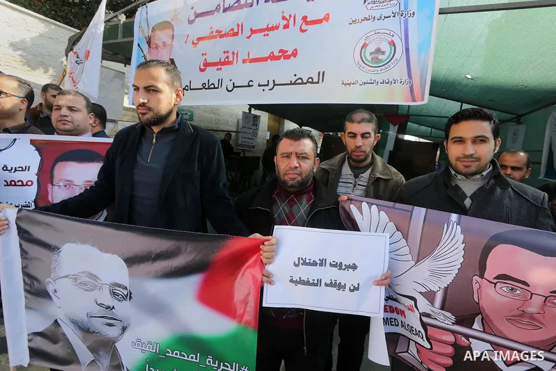 Palestinian journalists take part in a protest demanding release the Palestinian journalist Mohammed al-Qiq in Israeli jails, in front of Red cross office in Gaza city on Jan. 14, 2016. Qiq, a 33-year-old reporter for Sa...