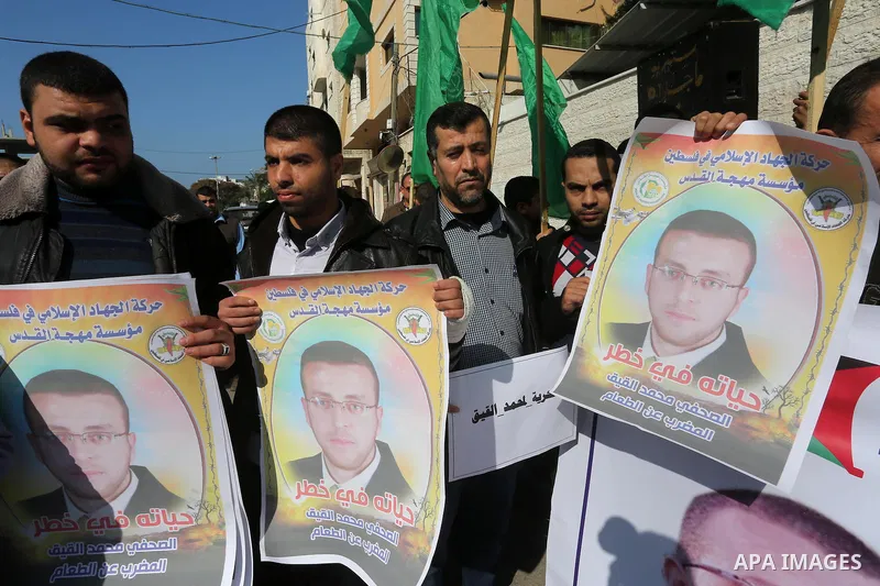Palestinian journalists take part in a protest demanding release the Palestinian journalist Mohammed al-Qiq in Israeli jails, in front of Red cross office in Gaza city on Jan. 14, 2016. Qiq, a 33-year-old reporter for Sa...