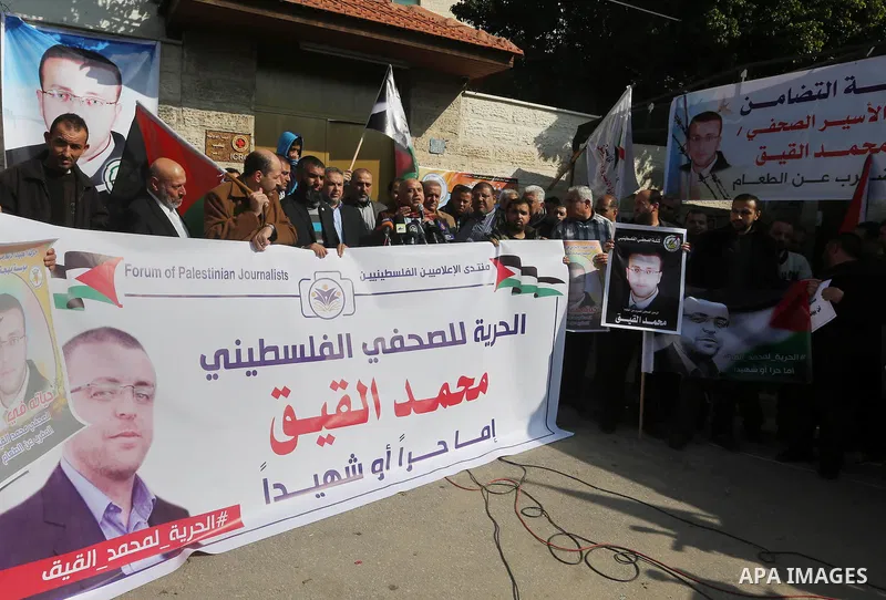 Palestinian journalists take part in a protest demanding release the Palestinian journalist Mohammed al-Qiq in Israeli jails, in front of Red cross office in Gaza city on Jan. 14, 2016. Qiq, a 33-year-old reporter for Sa...