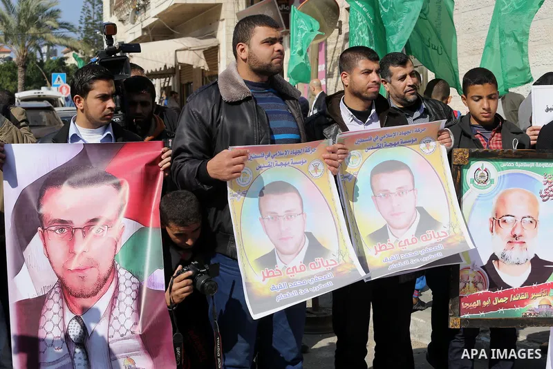 Palestinian journalists take part in a protest demanding release the Palestinian journalist Mohammed al-Qiq in Israeli jails, in front of Red cross office in Gaza city on Jan. 14, 2016. Qiq, a 33-year-old reporter for Sa...