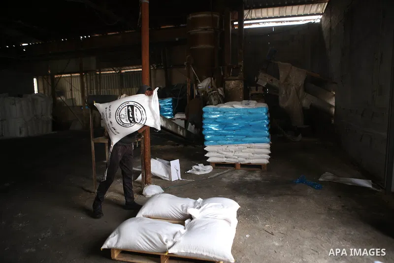 A Palestinian worker extracts salt from the Dead Sea, at his factory, in the West Bank city of Jericho on January 14, 2016. The Dead Sea also called the Salt Sea, is a salt lake with borders to Jordan in the east and the...