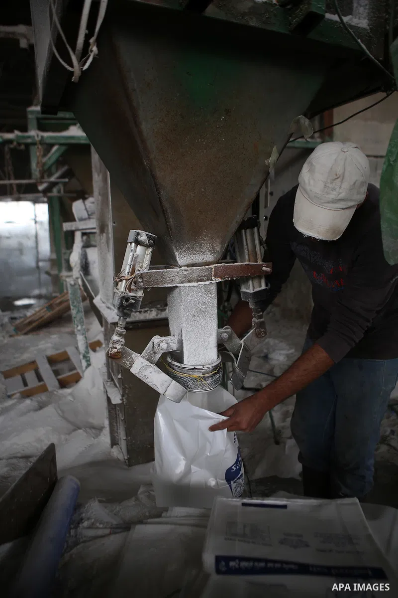 A Palestinian worker extracts salt from the Dead Sea, at his factory, in the West Bank city of Jericho on January 14, 2016. The Dead Sea also called the Salt Sea, is a salt lake with borders to Jordan in the east and the...