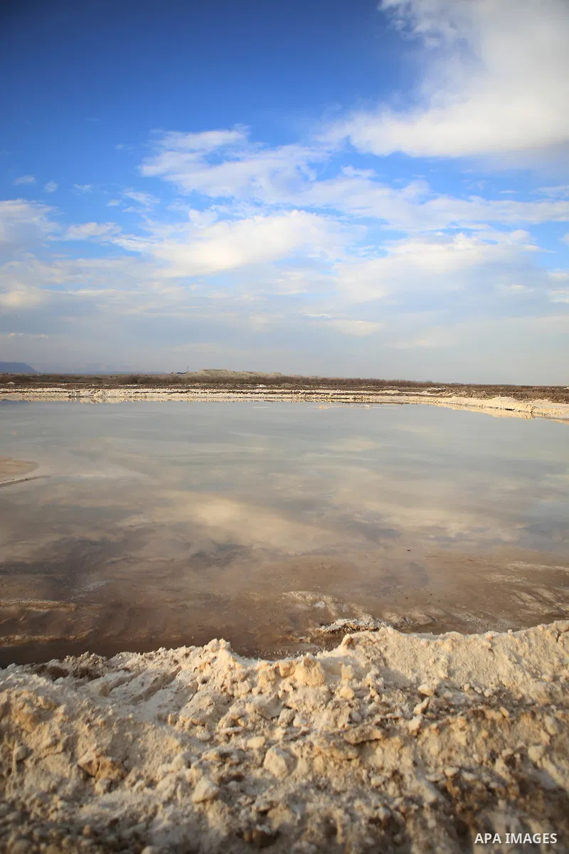 A general veiw show the salt extraction "raw material" from the Dead Sea, in the West Bank city of Jericho on January 14, 2016. The Dead Sea also called the Salt Sea, is a salt lake with borders to Jordan in the east and...