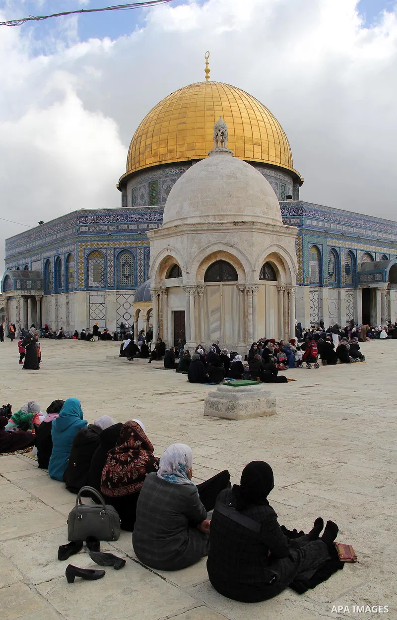 Palestinian Muslim worshipers attend Friday prayers in front of the Dome of the Rock mosque at al-Aqsa mosque compound, Islam's third holiest site, in Jerusalem's Old city on Jan. 15, 2016. Photo by Mahfouz Abu Turk