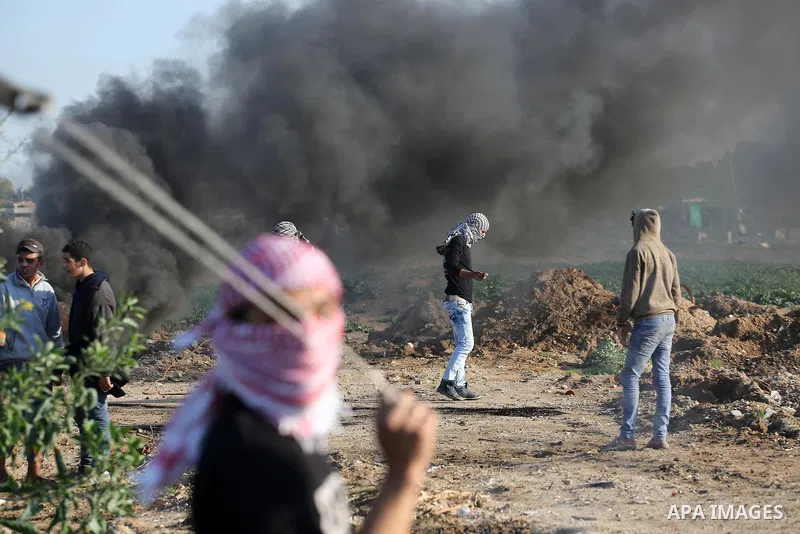 Palestinian protesters clash with Israeli security forces along the border fence with Israel on the eastern outskirts of Gaza City on Jan. 15, 2016. Israeli forces on Friday afternoon shot dead a Palestinian teenager dur...