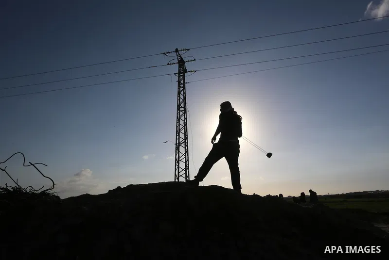 Palestinian protesters clash with Israeli security forces along the border fence with Israel on the eastern outskirts of Gaza City on Jan. 15, 2016. Israeli forces on Friday afternoon shot dead a Palestinian teenager dur...