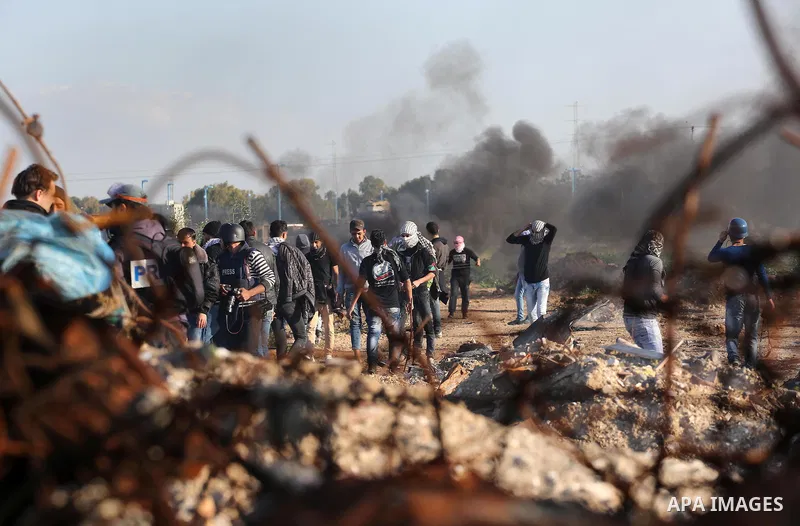 Palestinian protesters clash with Israeli security forces along the border fence with Israel on the eastern outskirts of Gaza City on Jan. 15, 2016. Israeli forces on Friday afternoon shot dead a Palestinian teenager dur...