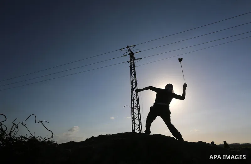 Palestinian protesters clash with Israeli security forces along the border fence with Israel on the eastern outskirts of Gaza City on Jan. 15, 2016. Israeli forces on Friday afternoon shot dead a Palestinian teenager dur...
