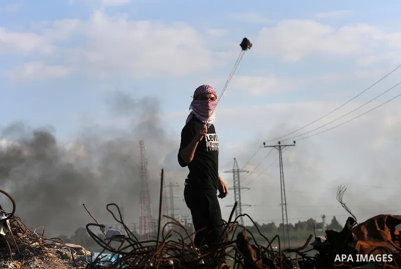 Palestinian protesters clash with Israeli security forces along the border fence with Israel on the eastern outskirts of Gaza City on Jan. 15, 2016. Israeli forces on Friday afternoon shot dead a Palestinian teenager dur...