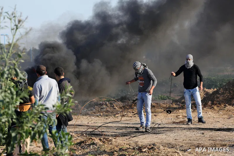 Palestinian protesters clash with Israeli security forces along the border fence with Israel on the eastern outskirts of Gaza City on Jan. 15, 2016. Israeli forces on Friday afternoon shot dead a Palestinian teenager dur...