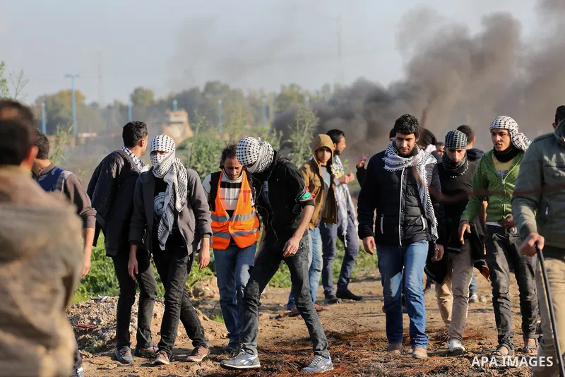 Palestinian protesters clash with Israeli security forces along the border fence with Israel on the eastern outskirts of Gaza City on Jan. 15, 2016. Israeli forces on Friday afternoon shot dead a Palestinian teenager dur...