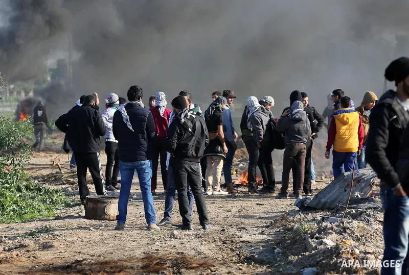 Palestinian protesters clash with Israeli security forces along the border fence with Israel on the eastern outskirts of Gaza City on Jan. 15, 2016. Israeli forces on Friday afternoon shot dead a Palestinian teenager dur...