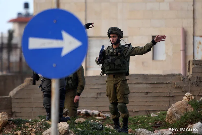 Israeli security forces take position during clashes with Palestinian protesters in Jalazoun refugee camp near the West bank city of Ramallah on Jan. 15, 2016. Photo by Shadi Hatem