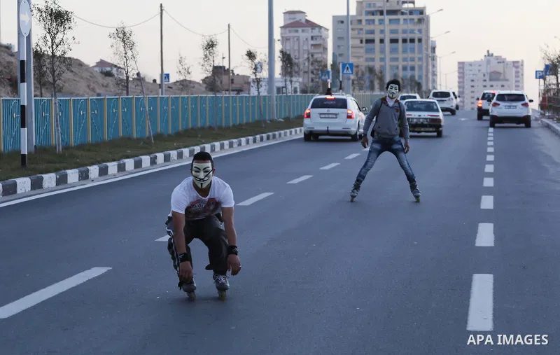 Palestinian youths show thier skills of using roller-skating on the beach of the Mediterranean Sea in Gaza City, on Jan. 15, 2016. Photo by Mohammed Asad