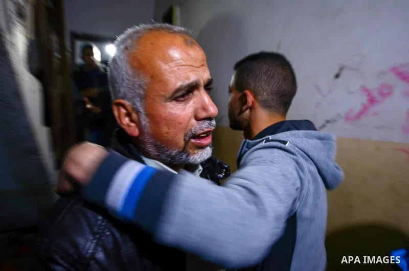 Relatives of young Palestinian man Mohammed Abu Zayed, who died after being shot in the neck by Israeli security forces at a protest, mourn at a hospital morgue in the central Gaza Strip January 15, 2016. A Palestinian w...