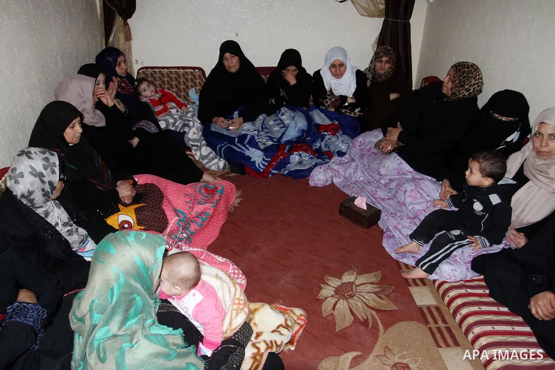 Relatives mourn during the funeral of Mohammed Qita in Khan Yunis in the southern Gaza Strip on January 16, 2016. Two Palestinians were shot dead by Israeli forces during protests along the border with Gaza on January 15...