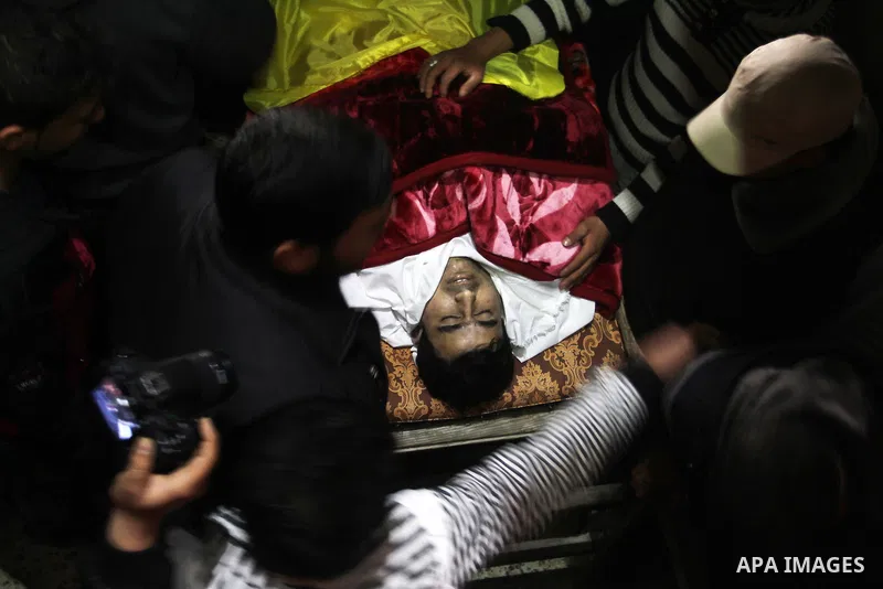 Palestinian carry the body of Mohammed Qita during his funeral, in Khan Yunis in the southern Gaza Strip on January 16, 2016. Two Palestinians were shot dead by Israeli forces during protests along the border with Gaza o...