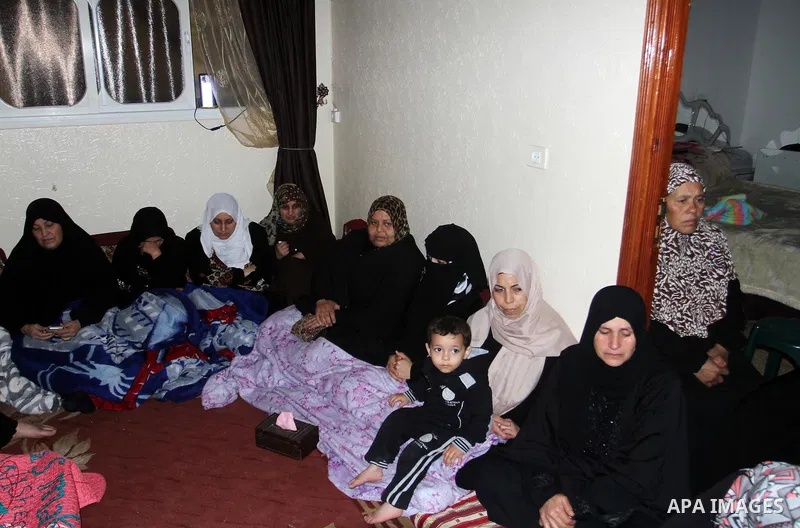 Relatives mourn during the funeral of Mohammed Qita in Khan Yunis in the southern Gaza Strip on January 16, 2016. Two Palestinians were shot dead by Israeli forces during protests along the border with Gaza on January 15...
