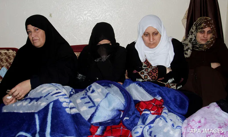 Relatives mourn during the funeral of Mohammed Qita in Khan Yunis in the southern Gaza Strip on January 16, 2016. Two Palestinians were shot dead by Israeli forces during protests along the border with Gaza on January 15...