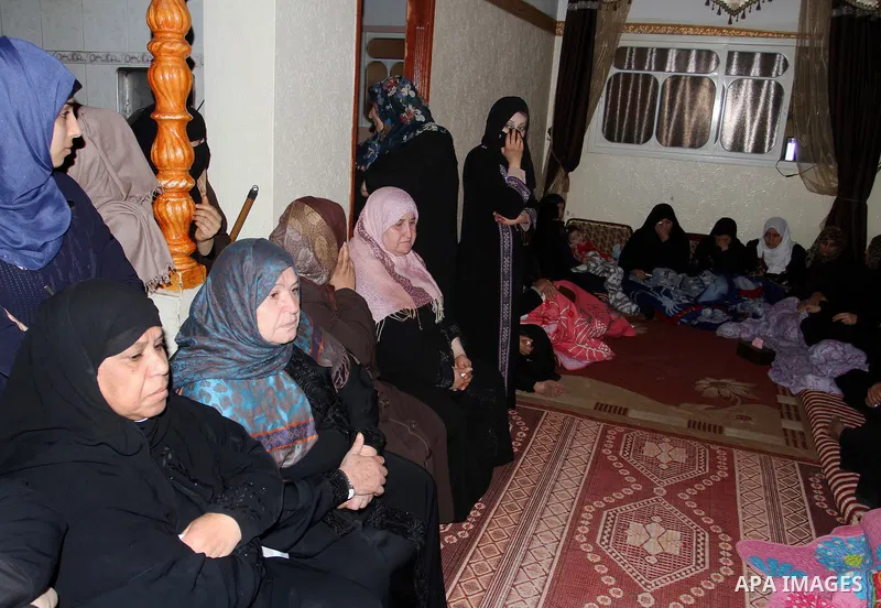 Relatives mourn during the funeral of Mohammed Qita in Khan Yunis in the southern Gaza Strip on January 16, 2016. Two Palestinians were shot dead by Israeli forces during protests along the border with Gaza on January 15...