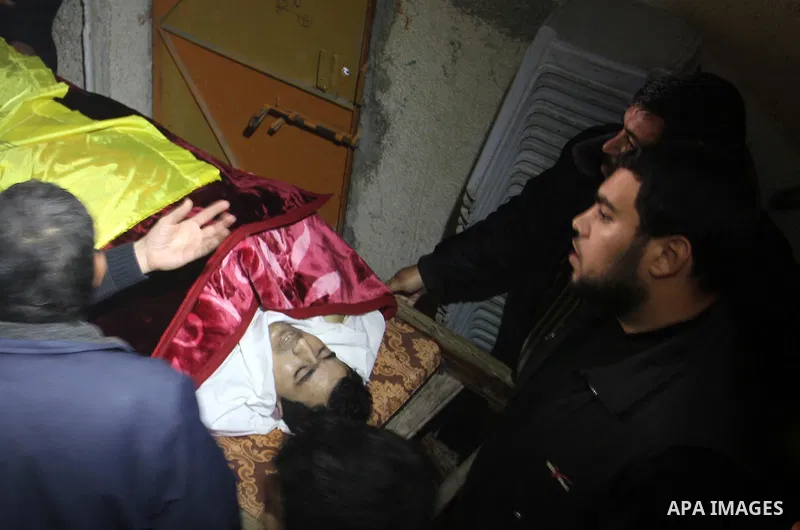 Palestinian carry the body of Mohammed Qita during his funeral, in Khan Yunis in the southern Gaza Strip on January 16, 2016. Two Palestinians were shot dead by Israeli forces during protests along the border with Gaza o...