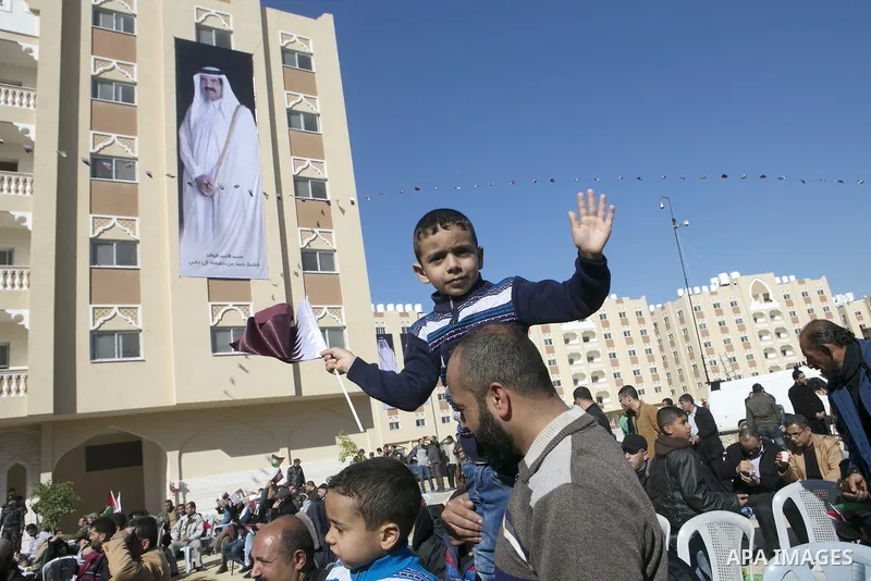 Palestinians gather at the Qatari-funded Hamad City housing complex in Khan Younis, southern Gaza Strip, Saturday, Jan. 16, 2016. More than 1,000 Palestinian families have taken possession of new apartments in the first...