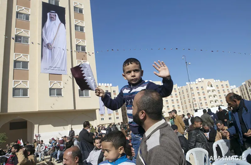Palestinians gather at the Qatari-funded Hamad City housing complex in Khan Younis, southern Gaza Strip, Saturday, Jan. 16, 2016. More than 1,000 Palestinian families have taken possession of new apartments in the first...