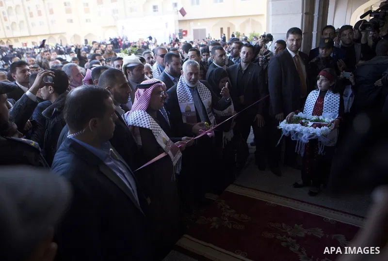Palestinians gather at the Qatari-funded Hamad City housing complex in Khan Younis, southern Gaza Strip, Saturday, Jan. 16, 2016. More than 1,000 Palestinian families have taken possession of new apartments in the first...