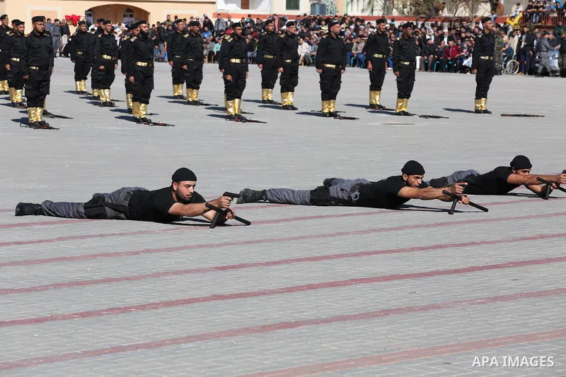 Palestinian members of officers display their skills during a graduation ceremony, in Gaza city on January 17, 2016. Photo by Mohammed Asad