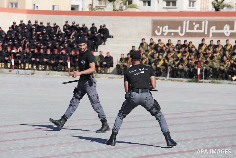 Palestinian members of officers display their skills during a graduation ceremony, in Gaza city on January 17, 2016. Photo by Mohammed Asad