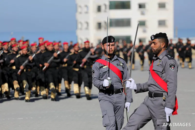 Palestinian members of officers display their skills during a graduation ceremony, in Gaza city on January 17, 2016. Photo by Mohammed Asad