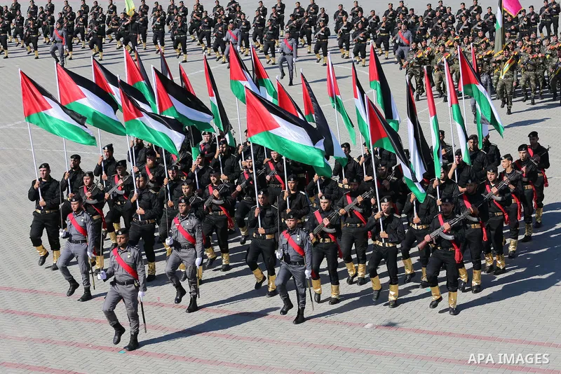 Palestinian members of officers display their skills during a graduation ceremony, in Gaza city on January 17, 2016. Photo by Mohammed Asad