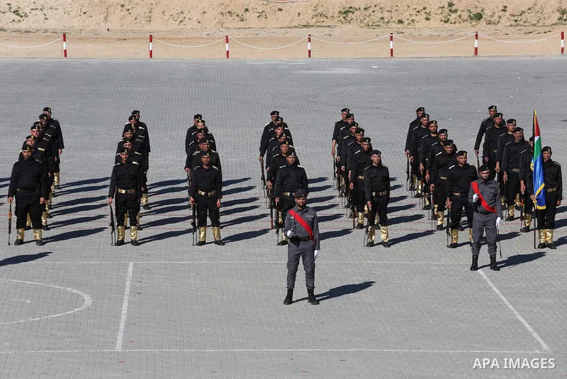 Palestinian members of officers display their skills during a graduation ceremony, in Gaza city on January 17, 2016. Photo by Mohammed Asad