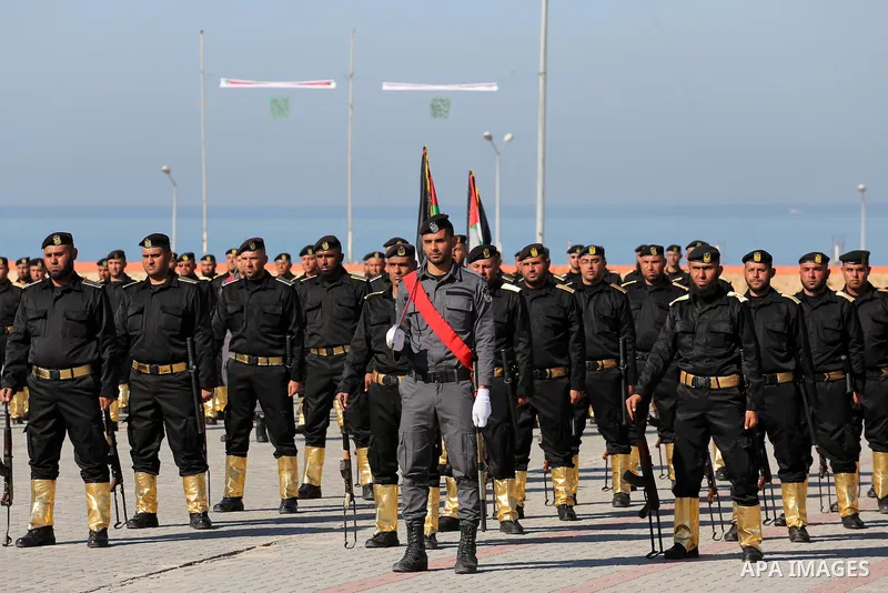 Palestinian members of officers display their skills during a graduation ceremony, in Gaza city on January 17, 2016. Photo by Mohammed Asad