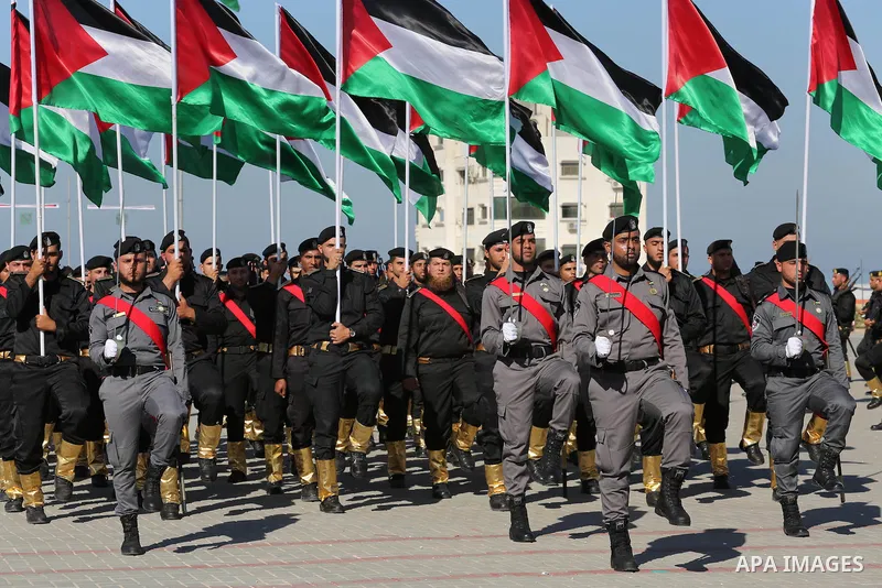 Palestinian members of officers display their skills during a graduation ceremony, in Gaza city on January 17, 2016. Photo by Mohammed Asad