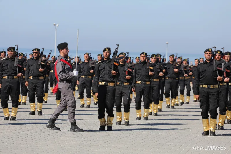 Palestinian members of officers display their skills during a graduation ceremony, in Gaza city on January 17, 2016. Photo by Mohammed Asad