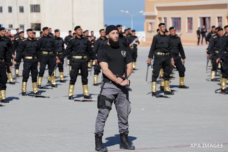 Palestinian members of officers display their skills during a graduation ceremony, in Gaza city on January 17, 2016. Photo by Mohammed Asad