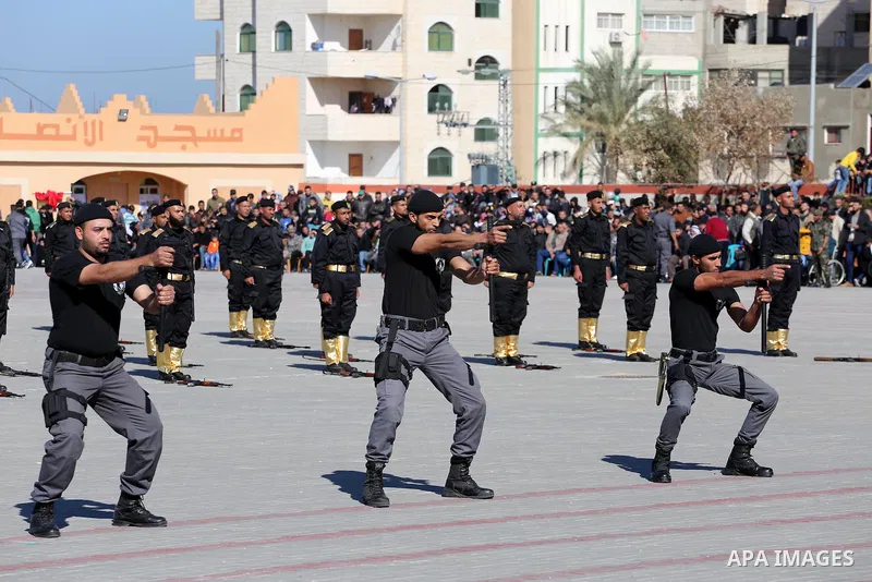 Palestinian members of officers display their skills during a graduation ceremony, in Gaza city on January 17, 2016. Photo by Mohammed Asad
