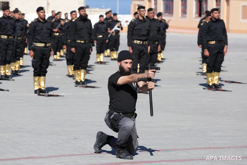 Palestinian members of officers display their skills during a graduation ceremony, in Gaza city on January 17, 2016. Photo by Mohammed Asad