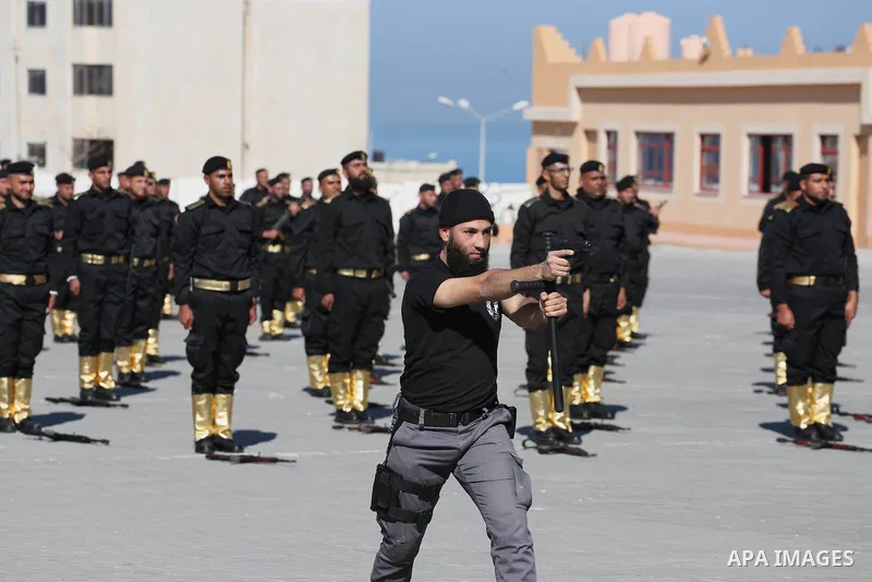 Palestinian members of officers display their skills during a graduation ceremony, in Gaza city on January 17, 2016. Photo by Mohammed Asad