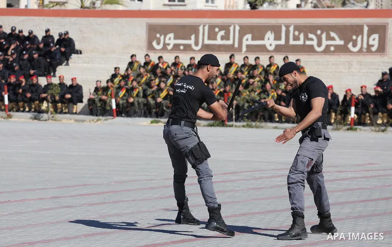 Palestinian members of officers display their skills during a graduation ceremony, in Gaza city on January 17, 2016. Photo by Mohammed Asad